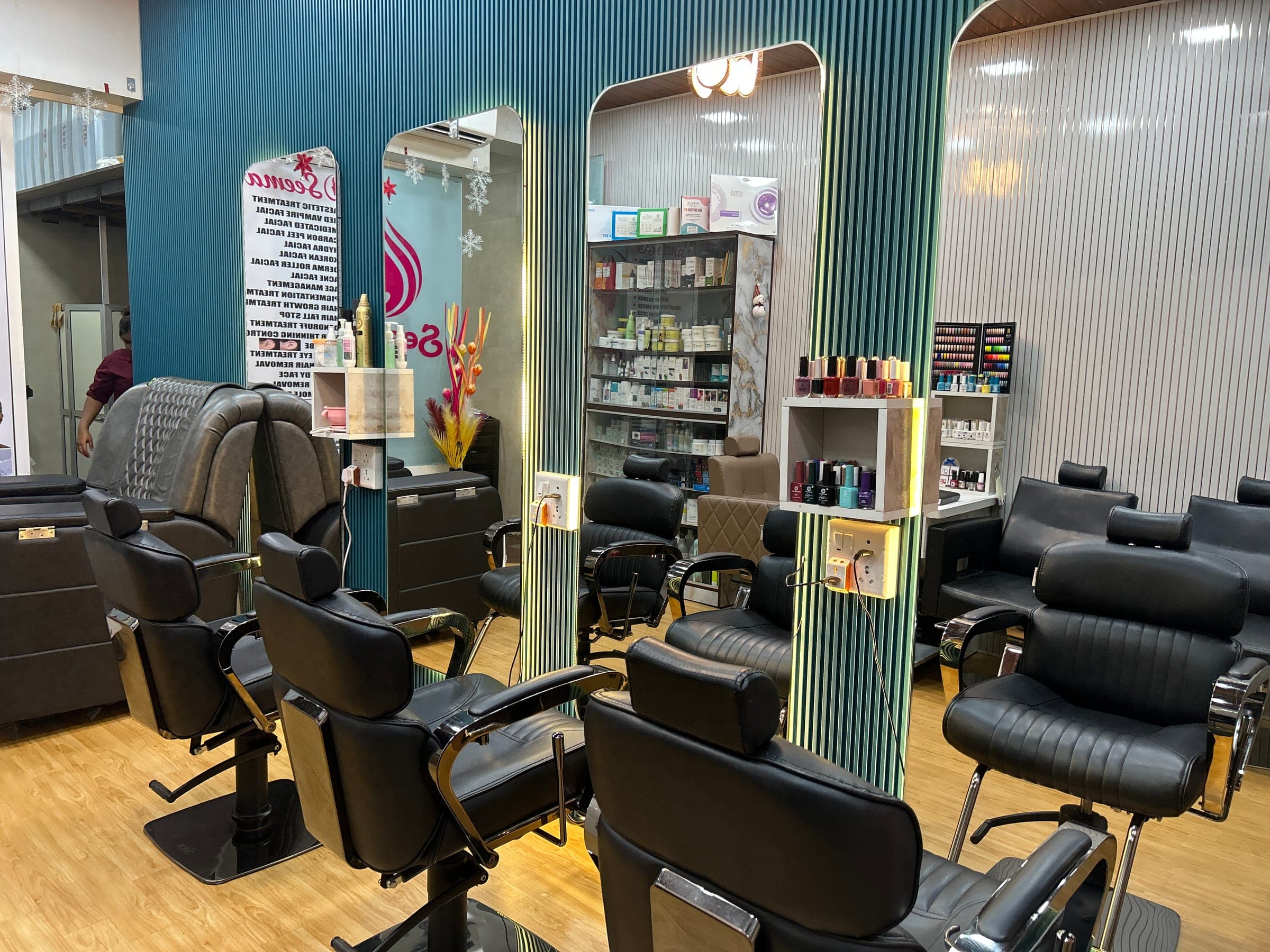Modern hair styling row with mirrored stations at Seema's Beauty Parlour
