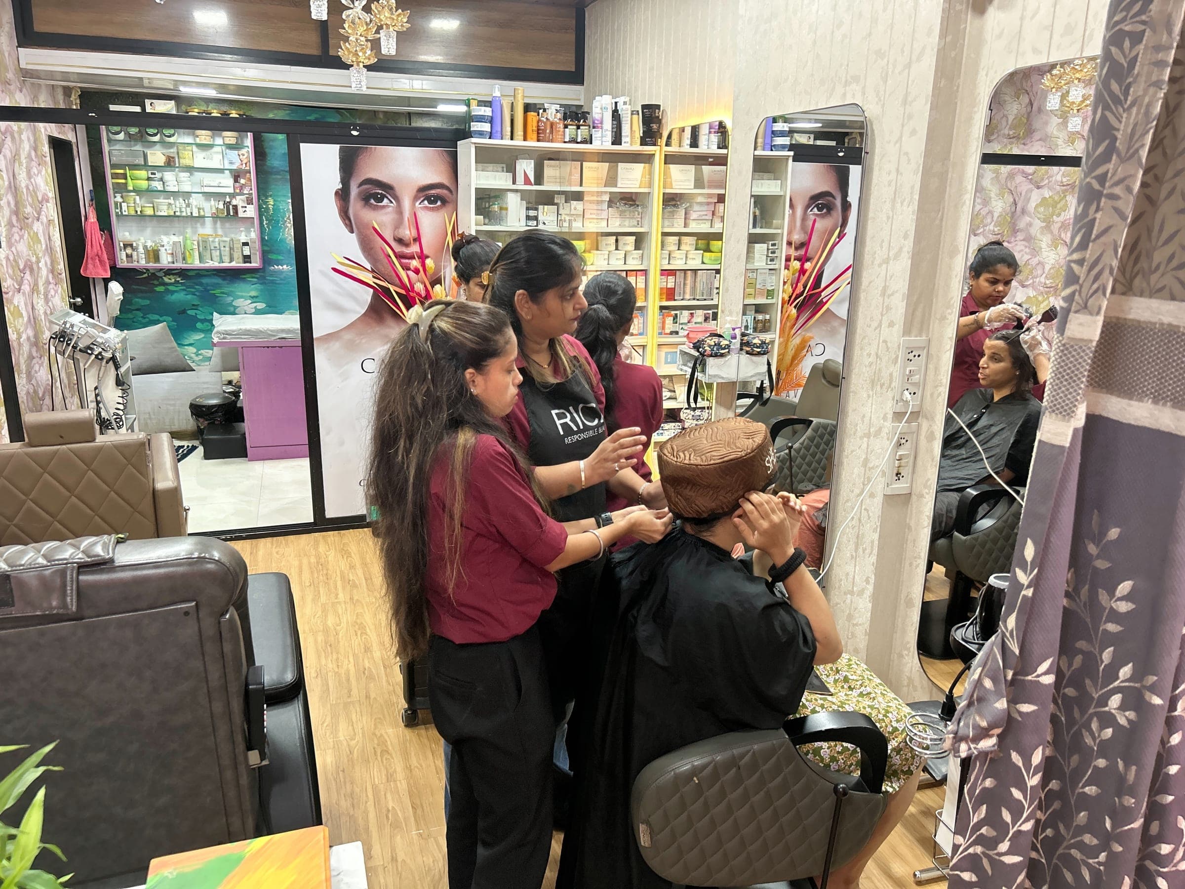 Stylists at work on a client