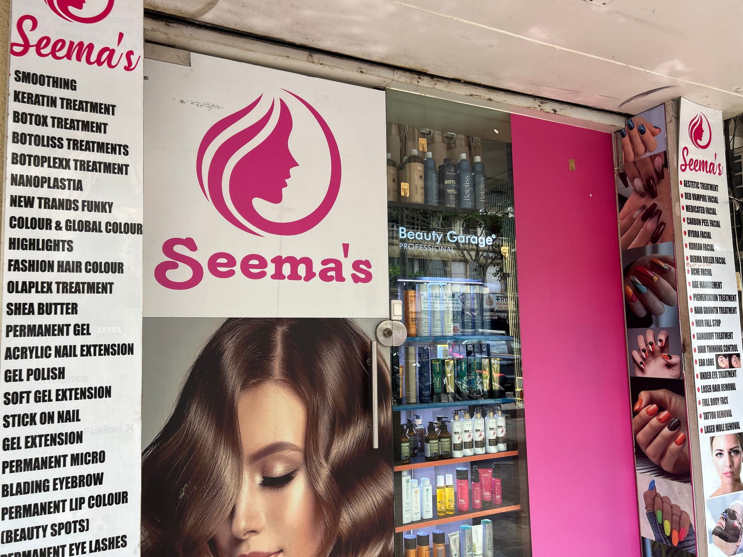 Storefront signage listing Seema's skin and hair treatment menu